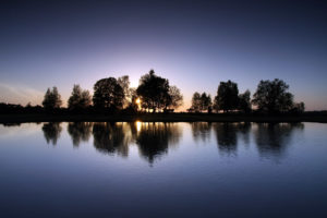 A sunset over Green Pond at Fritham in the New Forest, Hampshire.