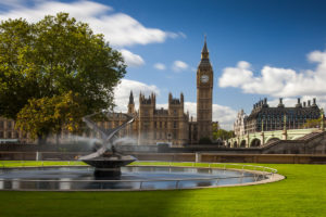 Long Exposure of Big Ben by Day in London with a fountain in the foreground.