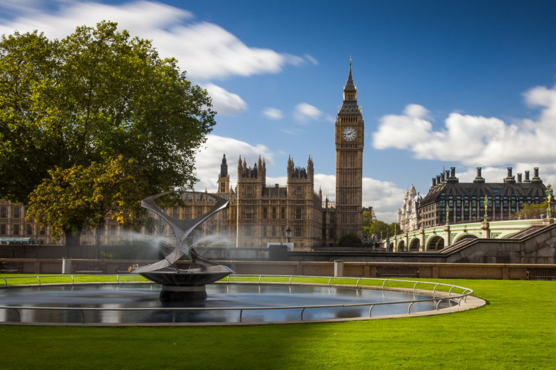 Long Exposure of Big Ben by Day in London with a fountain in the foreground.
