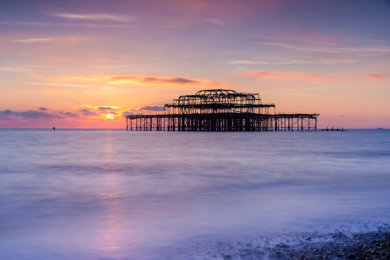 Sunset Over Remains of Old Brighton Pier