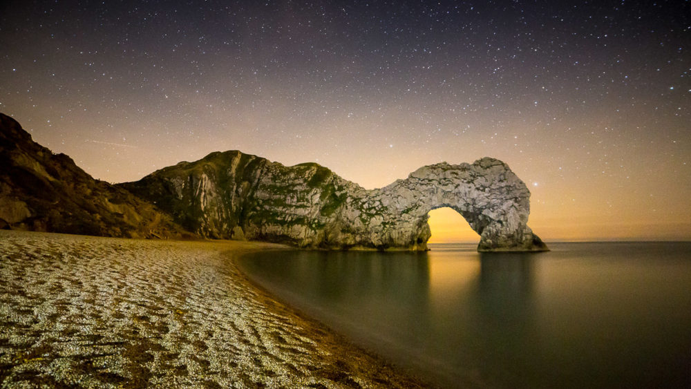 Night photography at Durdle Door Light Painting Durdle Door Photograph by Tim Jackson