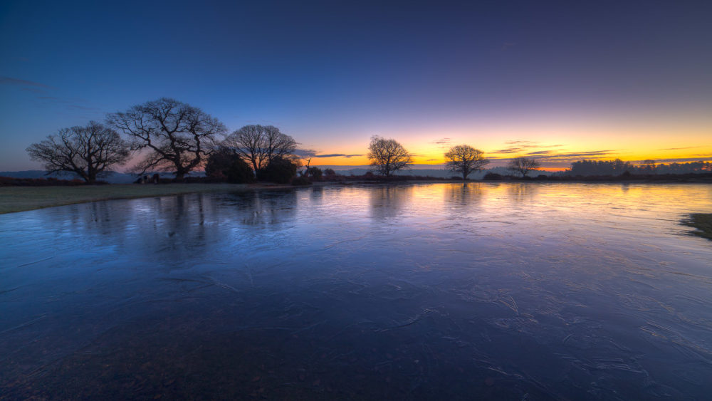 Samyang 14mm f2.8 for landscape photography. Mogshade Pond New Forest Dawn Photograph by Tim Jackson