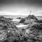 Make hay while the sun shines, which is not a lot in North Wales in February. Llanddwyn Island Photograph by Tim Jackson