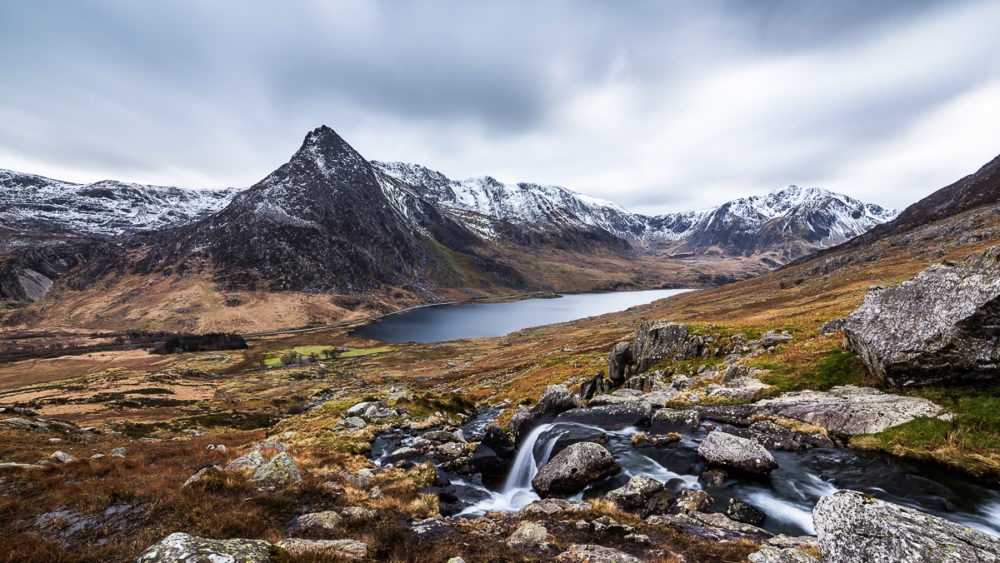 Make hay while the sun shines, which is not a lot in North Wales in February. Tryfan Snowdonia Photograph by Tim Jackson