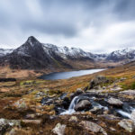 Make hay while the sun shines, which is not a lot in North Wales in February. Tryfan Snowdonia Photograph by Tim Jackson